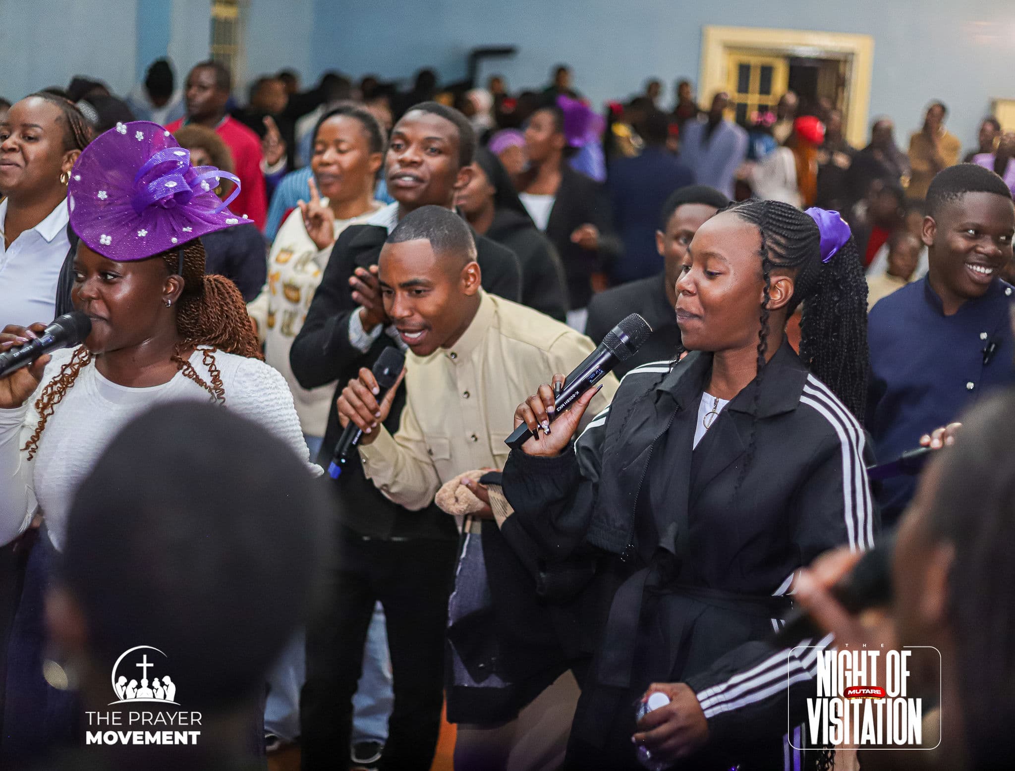 Congregation singing and worshipping together